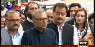 PTI's presidential nominee Dr. Arif Alvi signing papers for submission of nomination